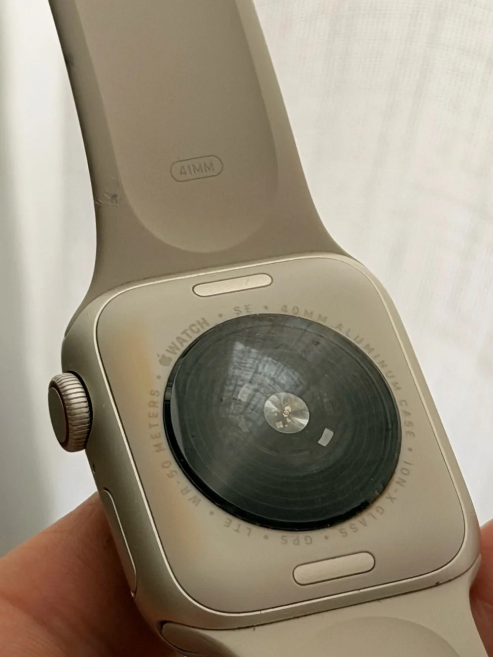 Apple Watch SE + cellular with Cream Sport Band